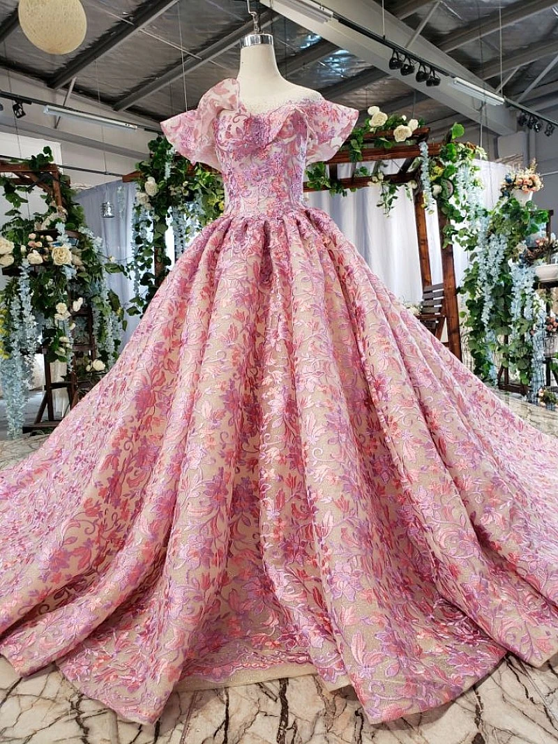 Pink lace open back ball gown with ornate bodice, bateau neckline and cap sleeves