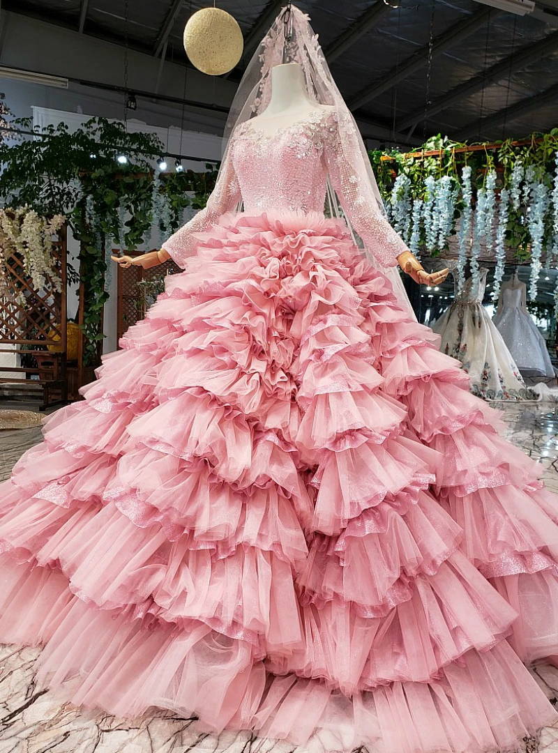 Pink bateau long sleeve ball gown wedding dress with ornamental beaded bodice