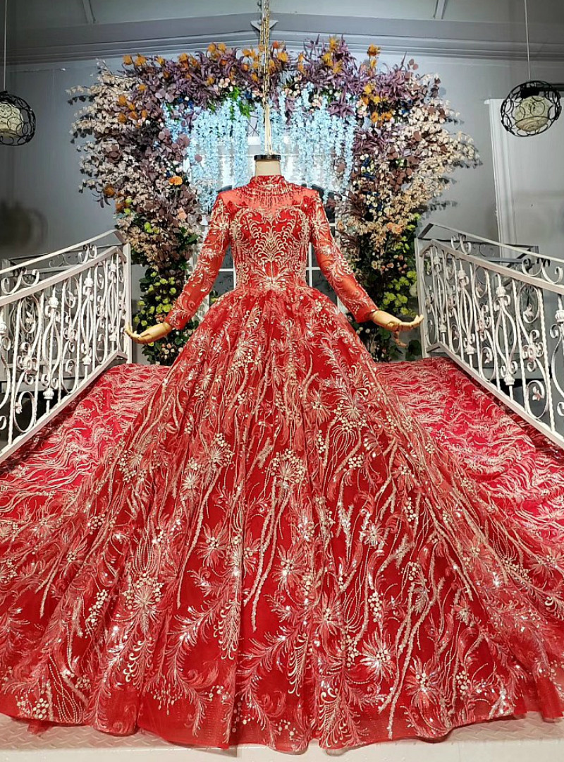 Red embroidered ball gown wedding dress with long sleeves and full tulle skirt