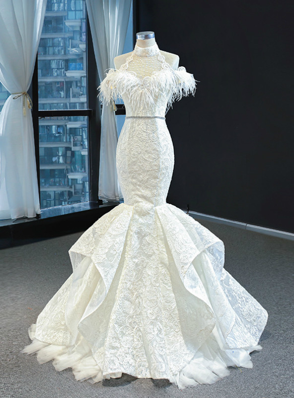 White lace mermaid prom dress with halter neckline beading feather detail and floor length silhouette