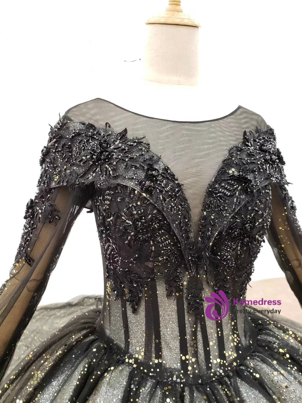 Black tulle ball gown with long sleeves and ornate sequin and beaded embellishment