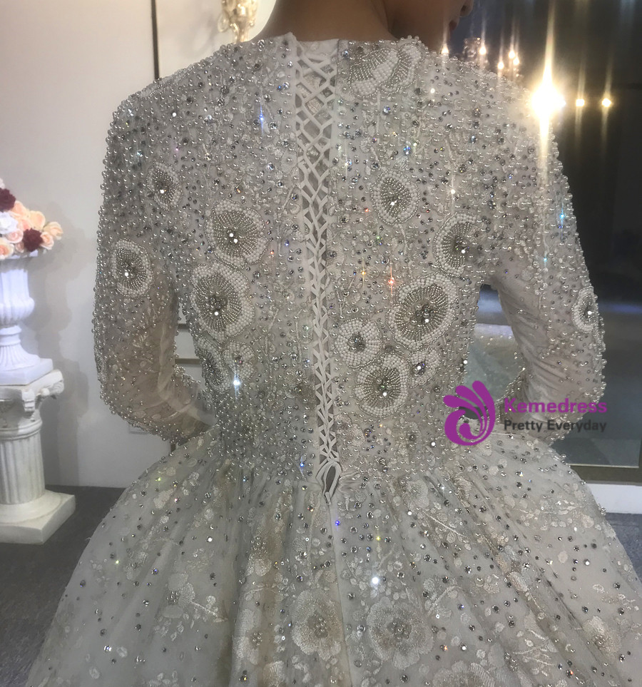 Luxury white beaded wedding dress with 3D floral embellishment detail