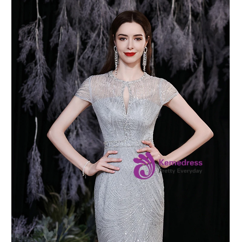 Silver mermaid gown with sequin mesh, lace up back and fitted floor length silhouette