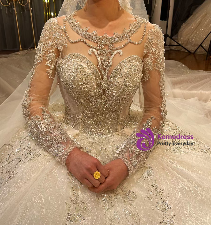 Luxury ivory royal couture wedding dress with long illusion sleeves, crystal beading and cathedral train