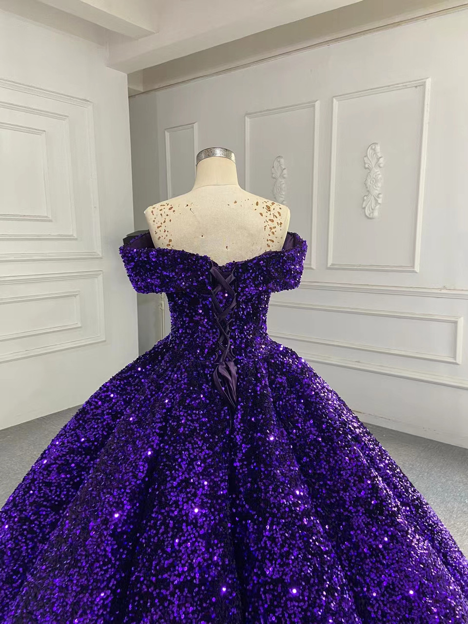 A stunning purple tontithios ballgown on a dress form on Craiyon