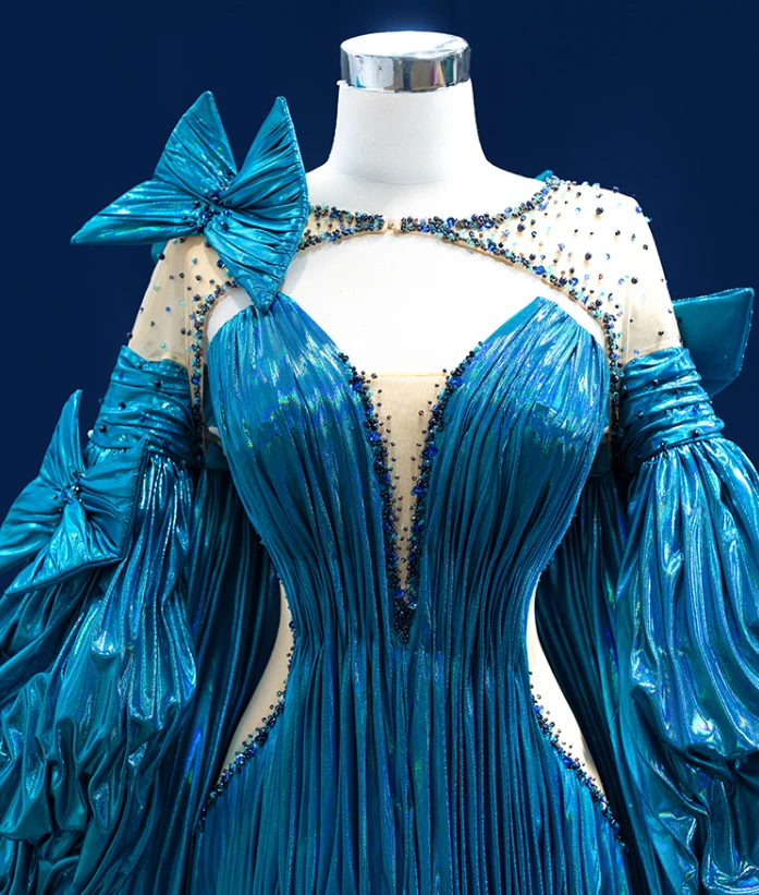Blue metallic mermaid prom gown with pleated skirt and dramatic train