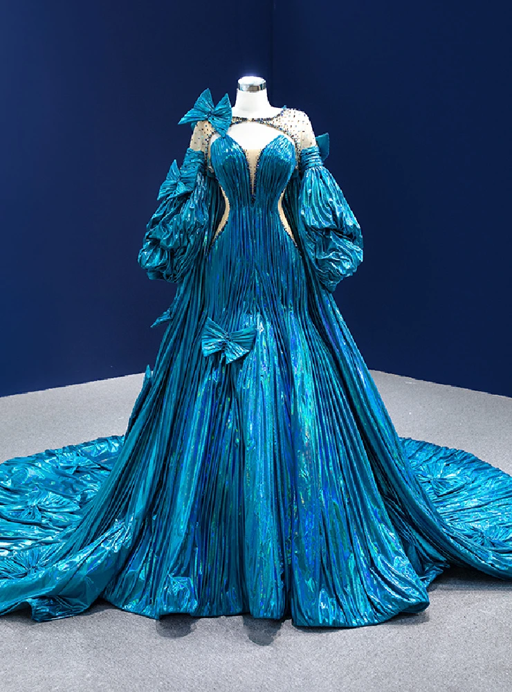 Metallic blue satin prom dress with oversized bow and mermaid silhouette