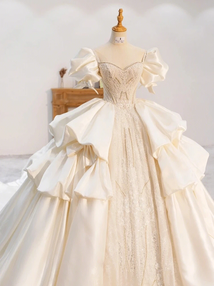 Ivory ball gown wedding dress with square neckline, crystal beading and detachable puff sleeves