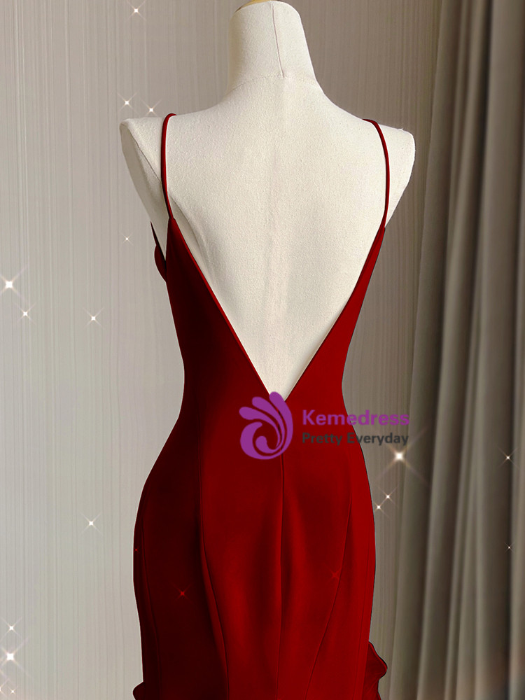 Burgundy mermaid prom dress with dramatic deep V open back and thin spaghetti straps