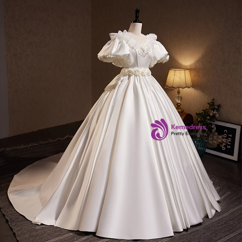 White satin puff sleeve ball gown wedding dress with rosette waist