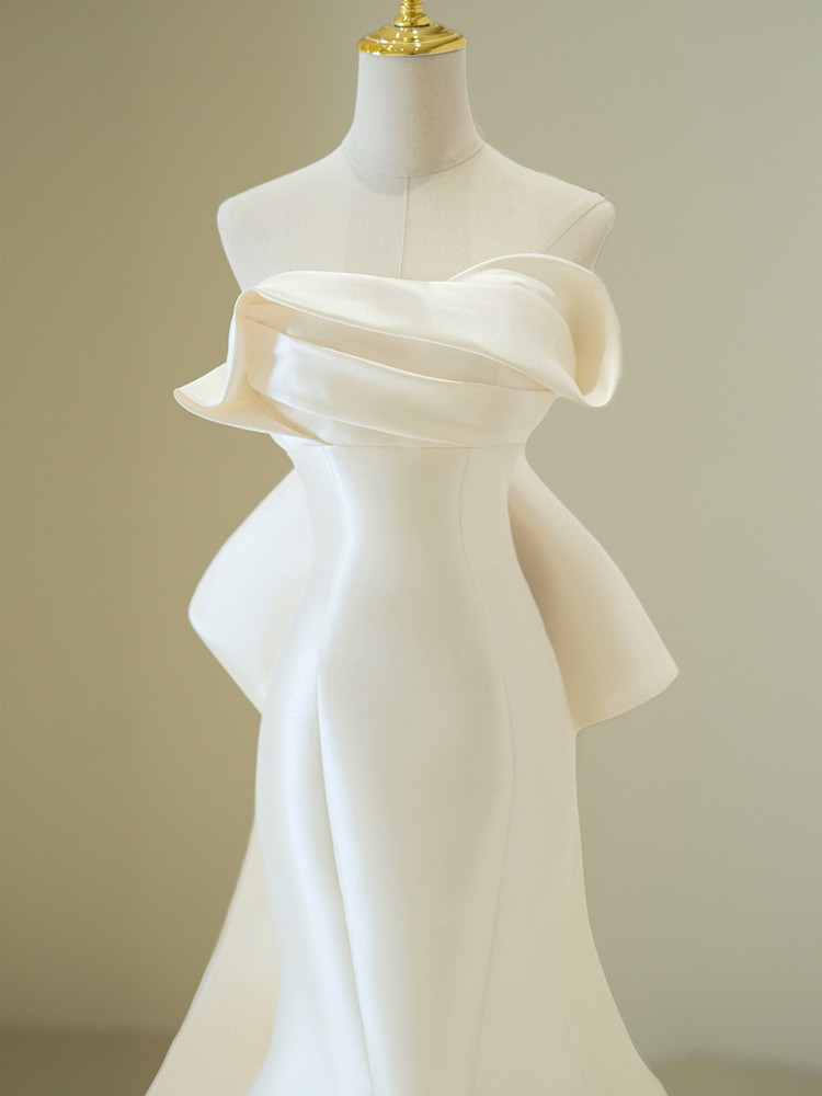 Ivory satin strapless pleated wedding dress with oversized back bow