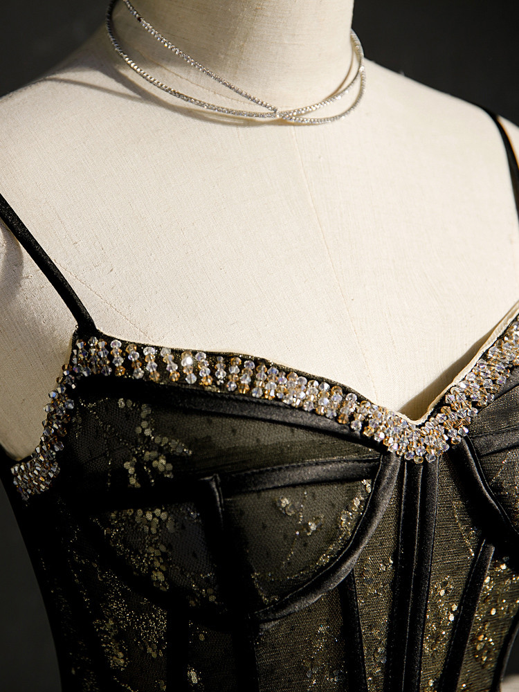 Close up of luxurious beaded floral sequin detail on black tulle homecoming dress