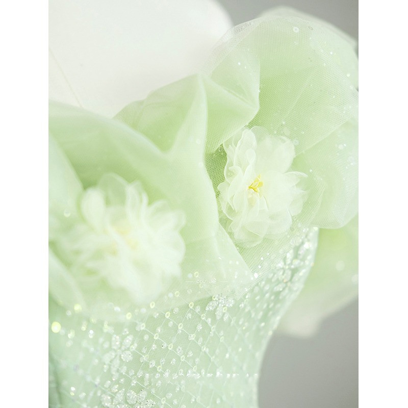 Mint green tulle prom dress with sequin details and floral puff sleeves