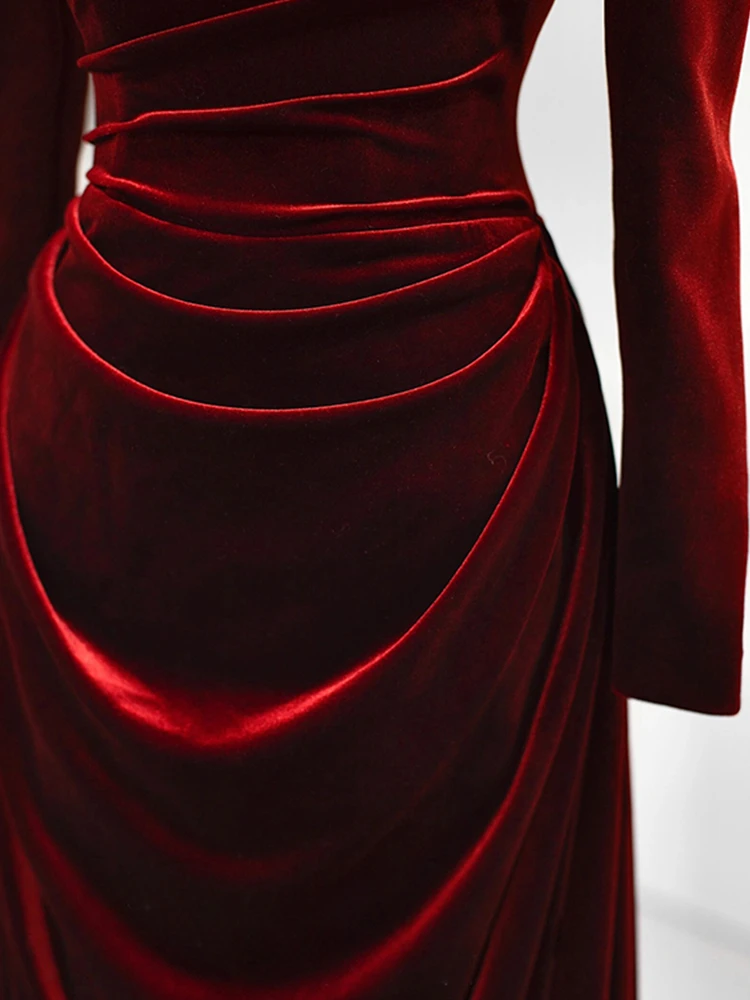 Burgundy velvet formal dress with sculpted pleated draping detail