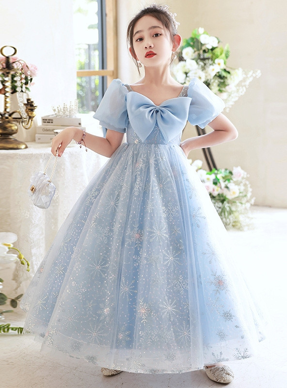 Light blue flower girl dress with oversized bow, puff sleeves and snowflake tulle