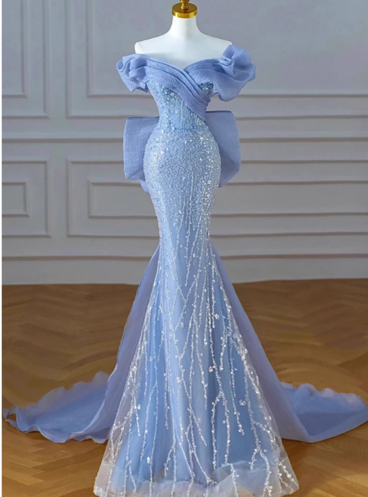 Sky blue mermaid prom dress with sequins and off shoulder neckline front view