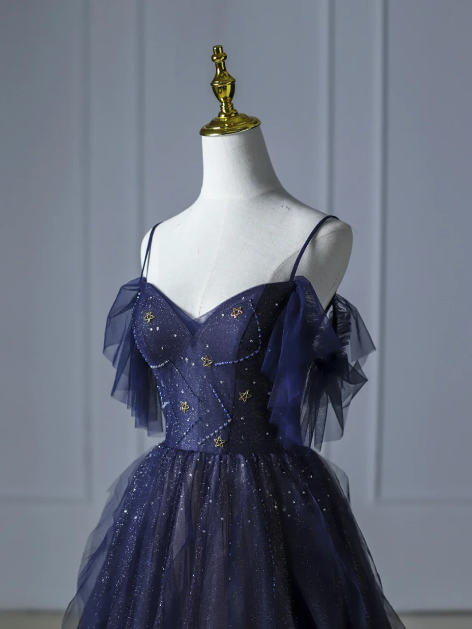 Blue tulle prom dress with star beadwork, sparkling details and layered tulle accents