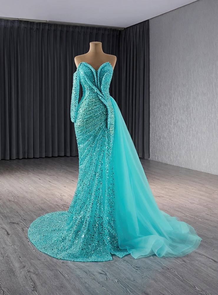 Green sequin mermaid prom dress with strapless sweetheart neckline and sheer long sleeves