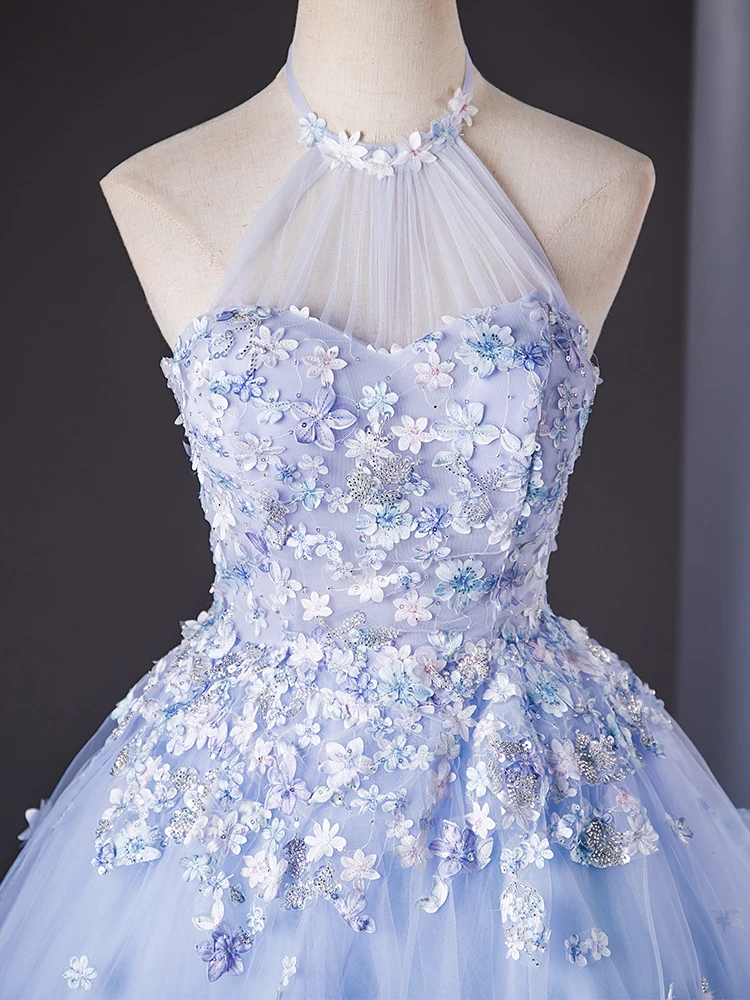 Blue quinceañera dress halter neckline floral corset and tulle skirt detail