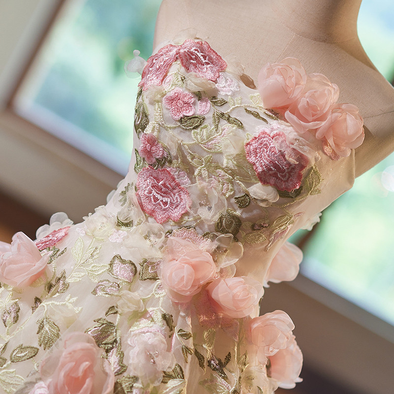 Ivory ball gown wedding dress with 3D floral embroidery and organza roses