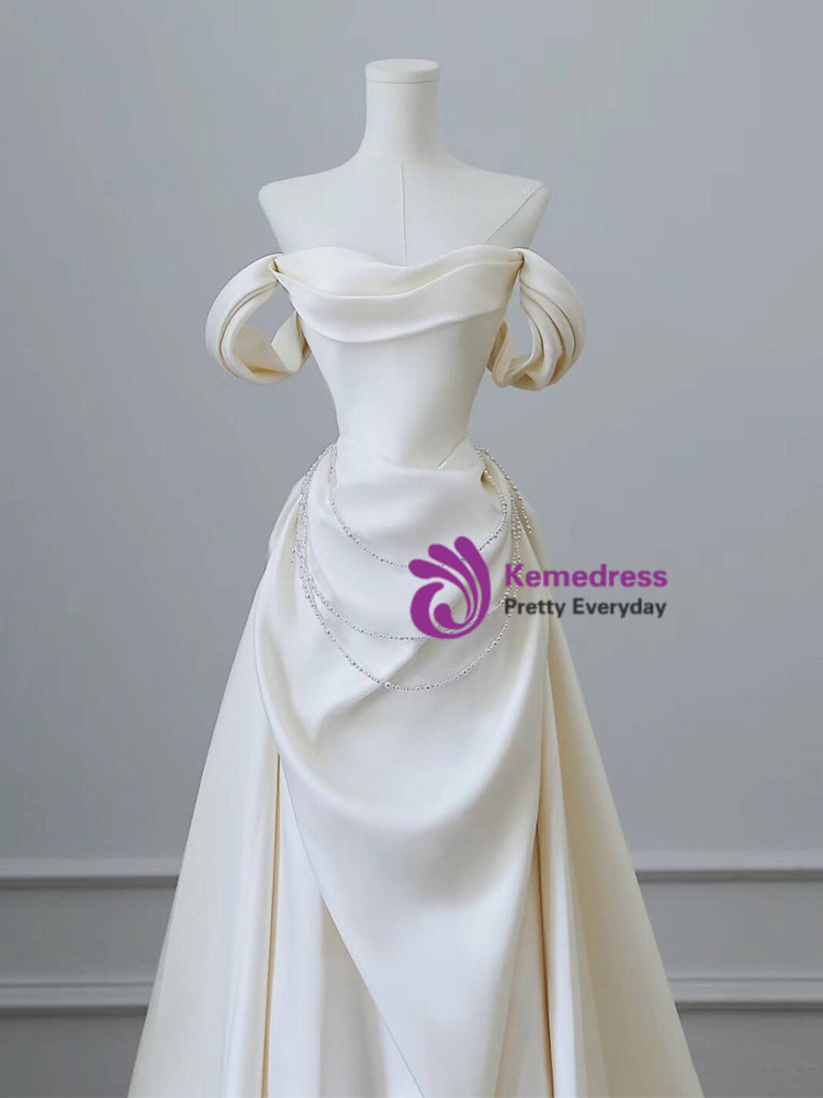 Ivory satin off shoulder wedding dress pearl crystal waist detail