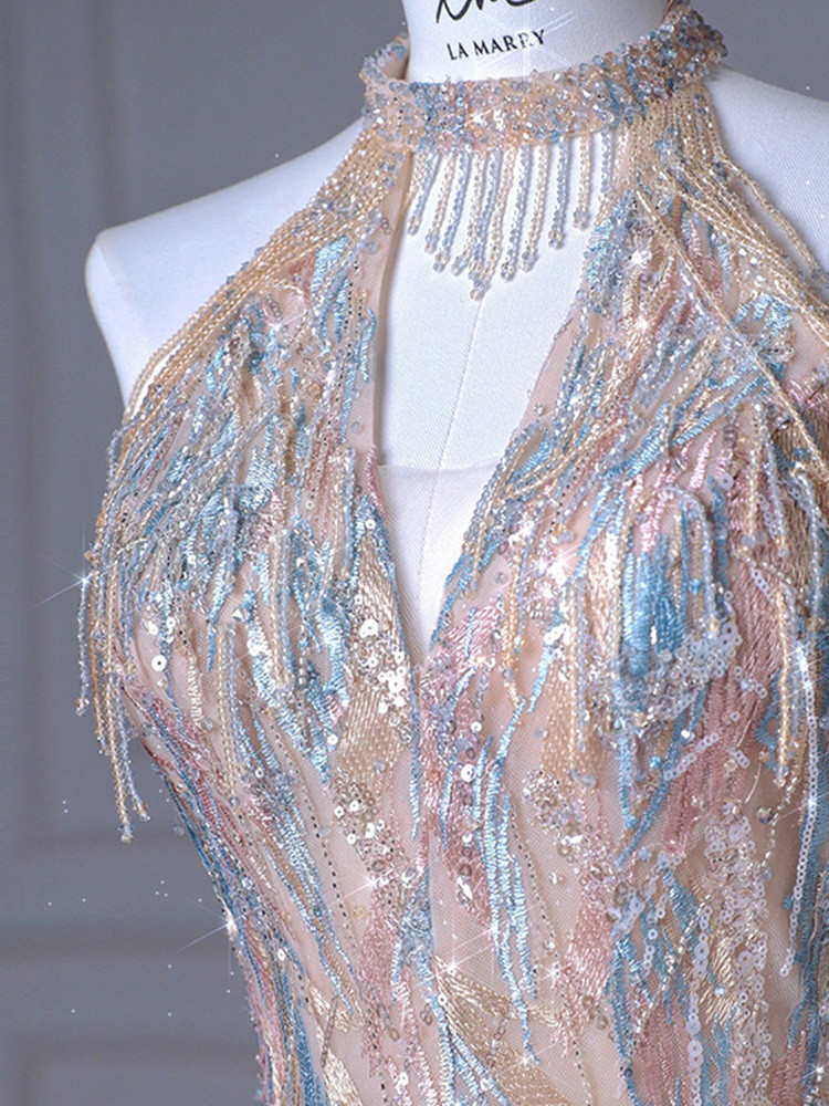 Close view of diagonal beading on champagne sequins halter prom dress
