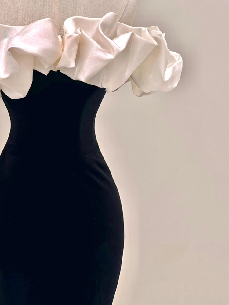 White satin off shoulder detail with black fitted mermaid skirt