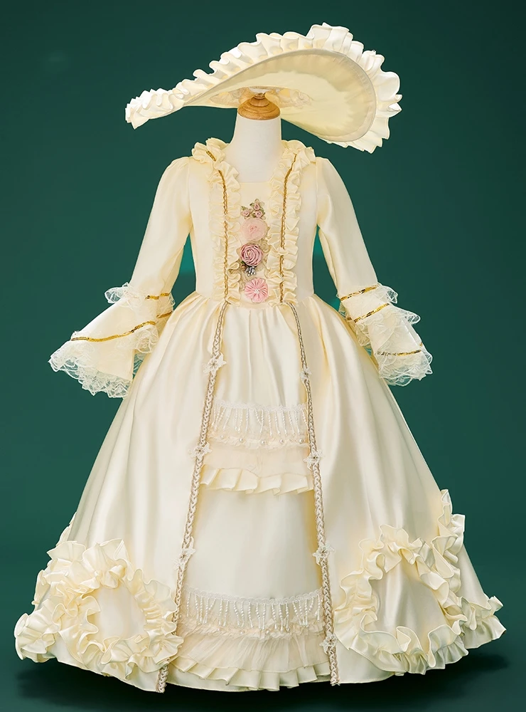 Champagne satin long sleeve flower girl dress with lace detailing and full skirt