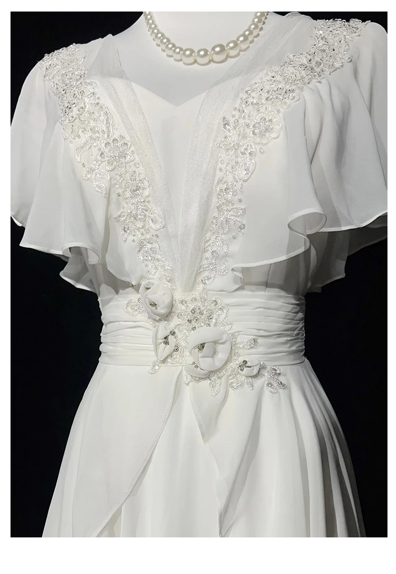 White chiffon wedding dress with floral appliques ruffle sleeves beaded V neckline and flowing layered skirt