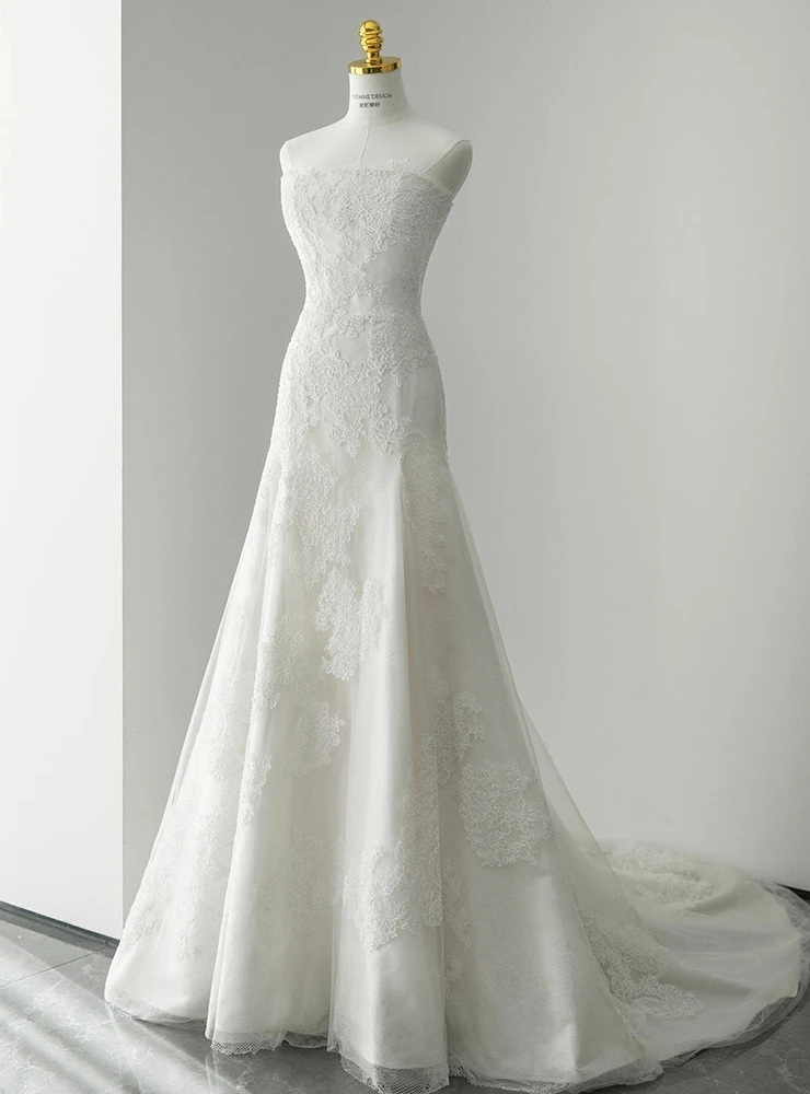 White strapless lace A-line wedding dress with layered tulle skirt