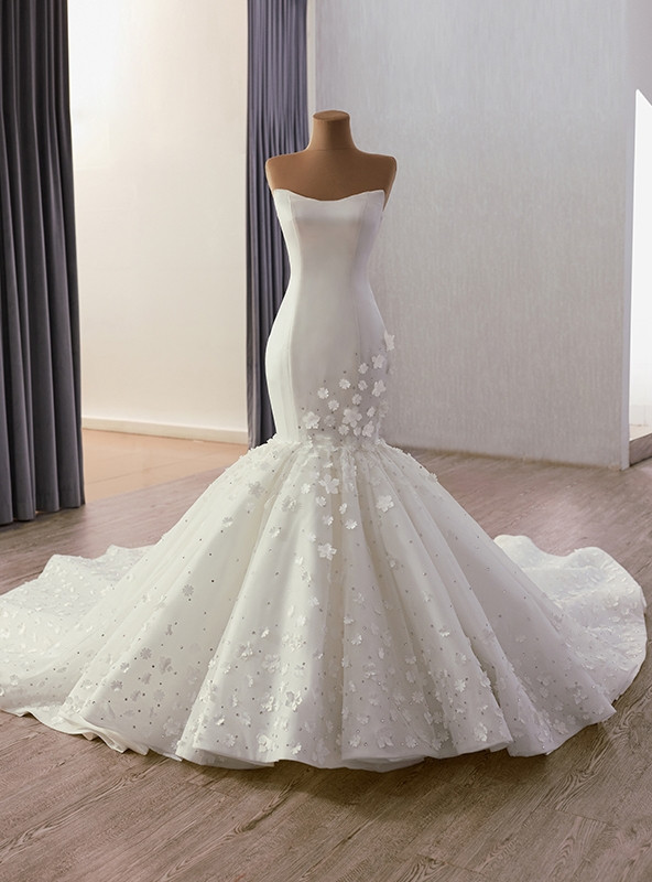 White mermaid wedding dress with strapless neckline and floral tulle skirt
