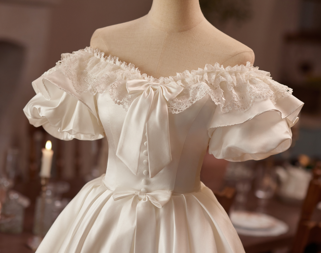 White satin puff sleeve lace bow homecoming dress detail