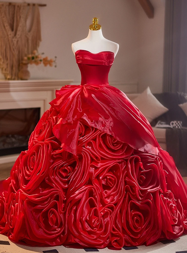 Red tulle ball gown quinceañera dress with full skirt and floral details