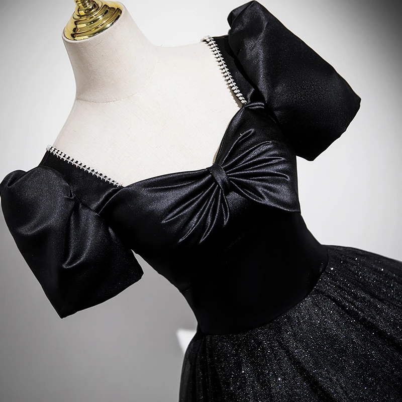 Full black sequin tulle ball gown prom dress with floor length skirt and puff sleeves