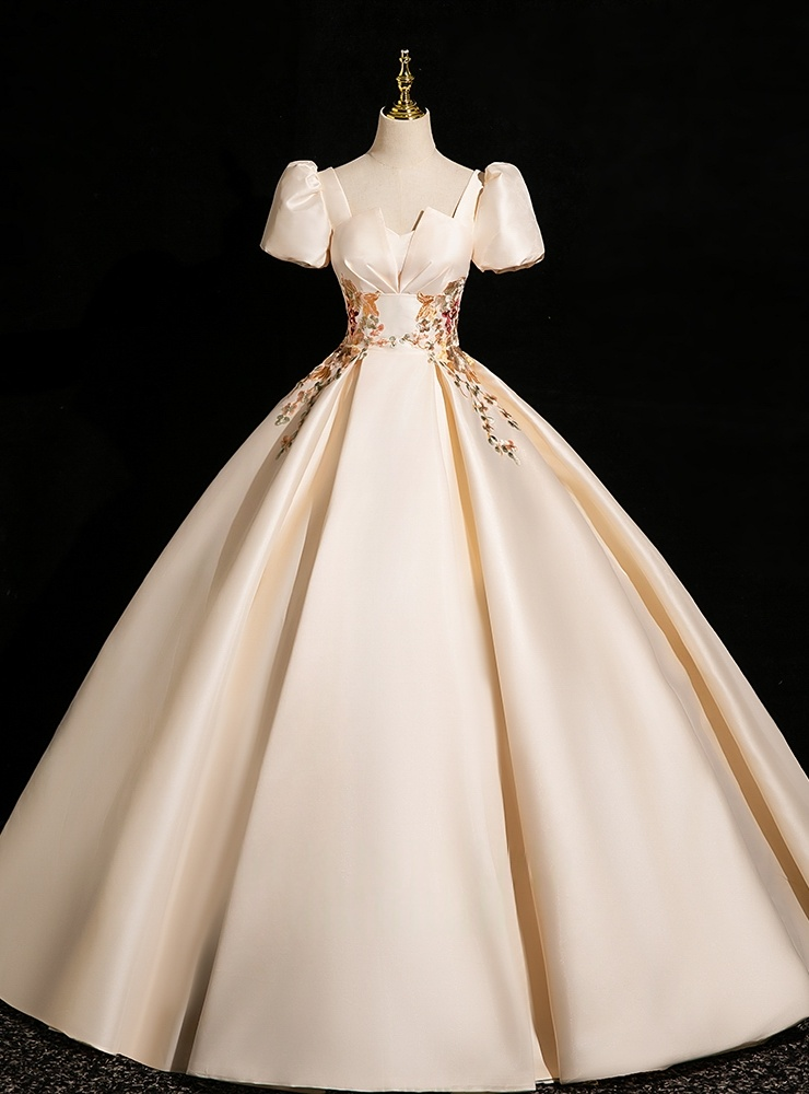 Champagne Quinceañera dress with square neckline puff sleeves appliqué and full satin skirt