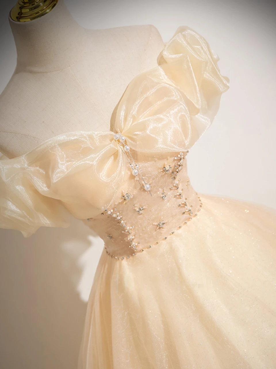 Beading and champagne tulle detail on quinceañera dress