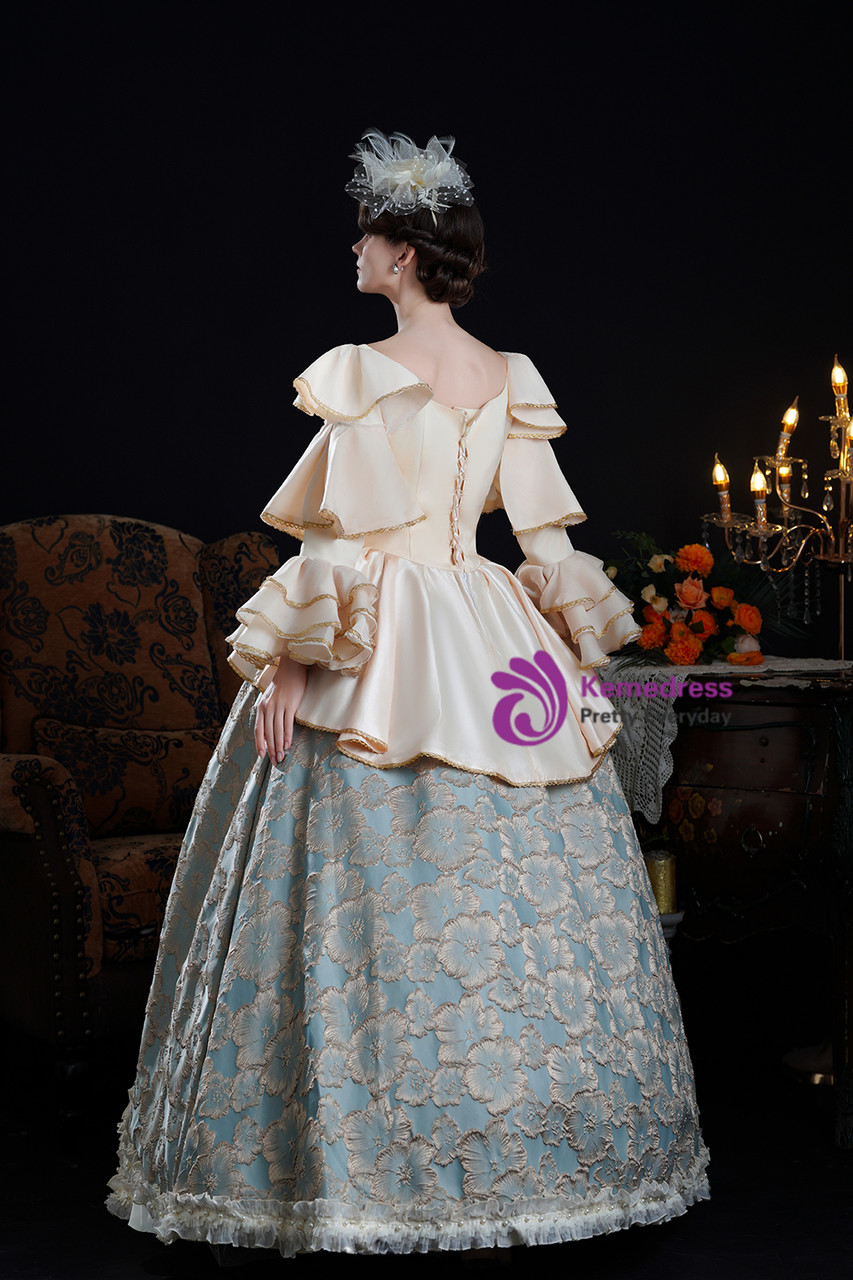 Close up detail of champagne satin, lace trim and powder blue Rococo dress