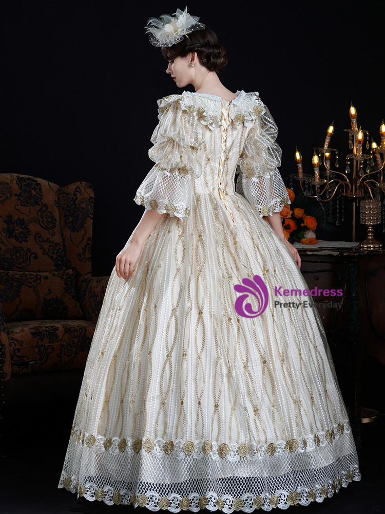 Back of champagne historical gown showing corset lace up closure and full skirt
