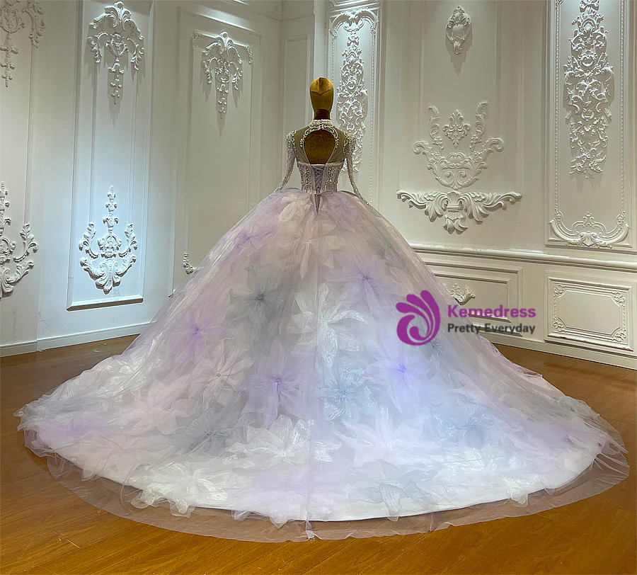 Purple tulle ball gown wedding dress with dimensional floral detailing and lace-up back