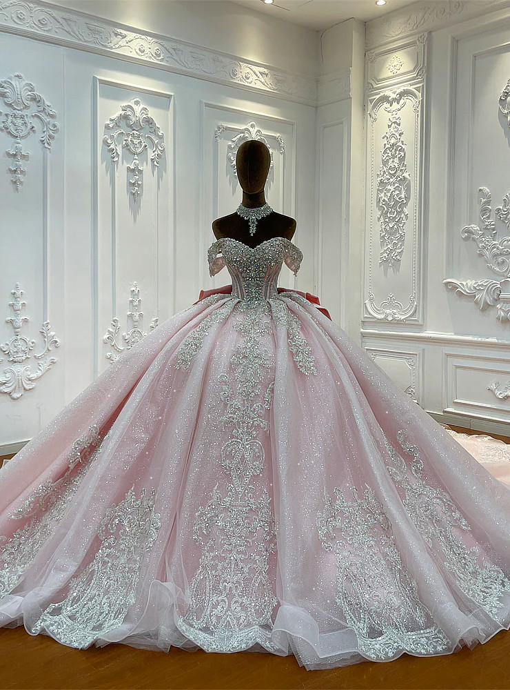 Pink beaded tulle ball gown wedding dress with off shoulder neckline