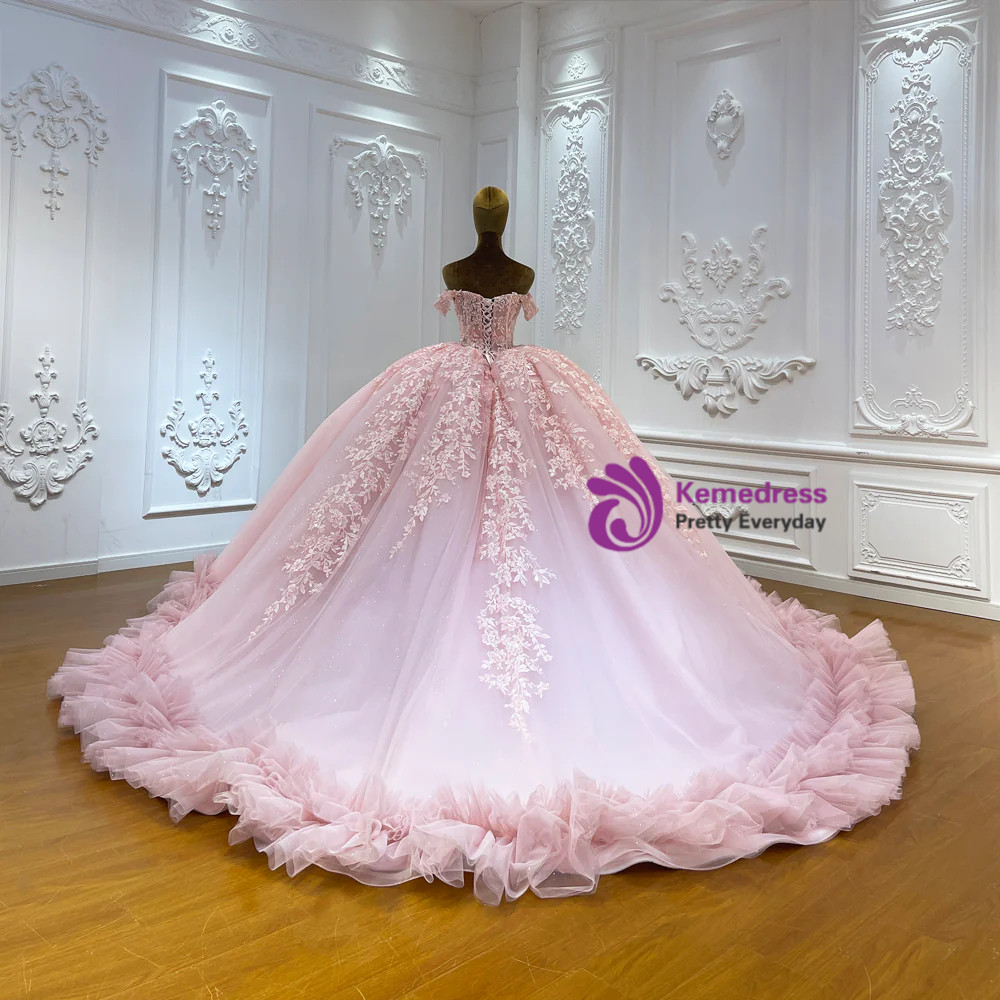 Pink wedding gown with vertical floral appliqué trails and layered tulle skirt