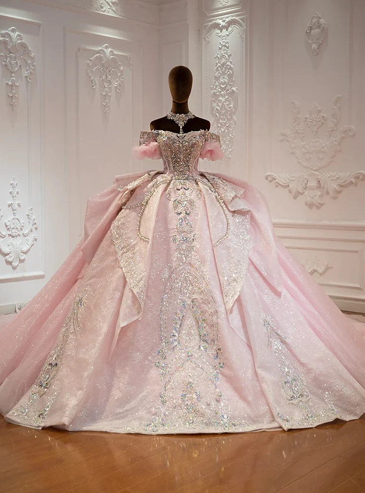 Pink tulle ball gown wedding dress with off shoulder beaded bodice