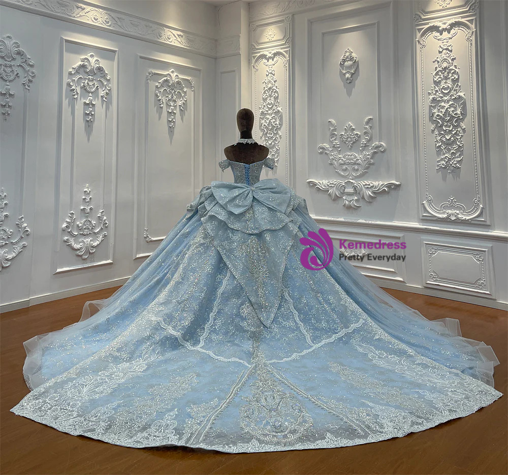 Close detail of blue tulle wedding dress with silver lace and sequin embellishment