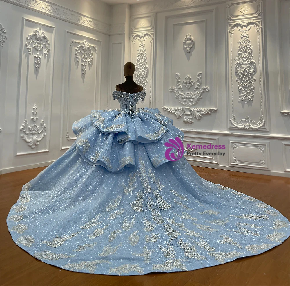 Back detail of blue princess wedding dress with lace up corset, architectural bow and cathedral train
