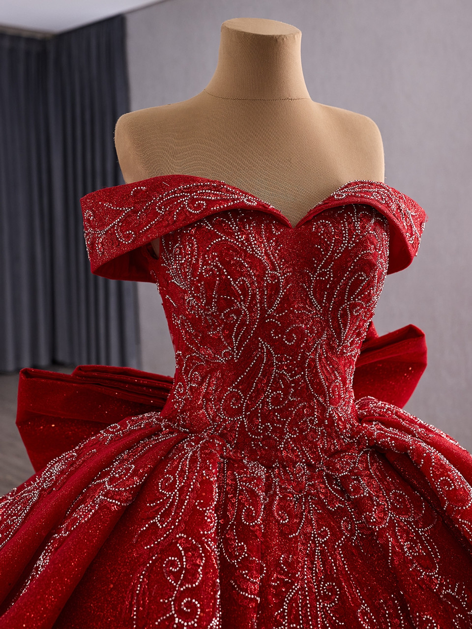 Red sequin ball gown full skirt and off the shoulder silhouette