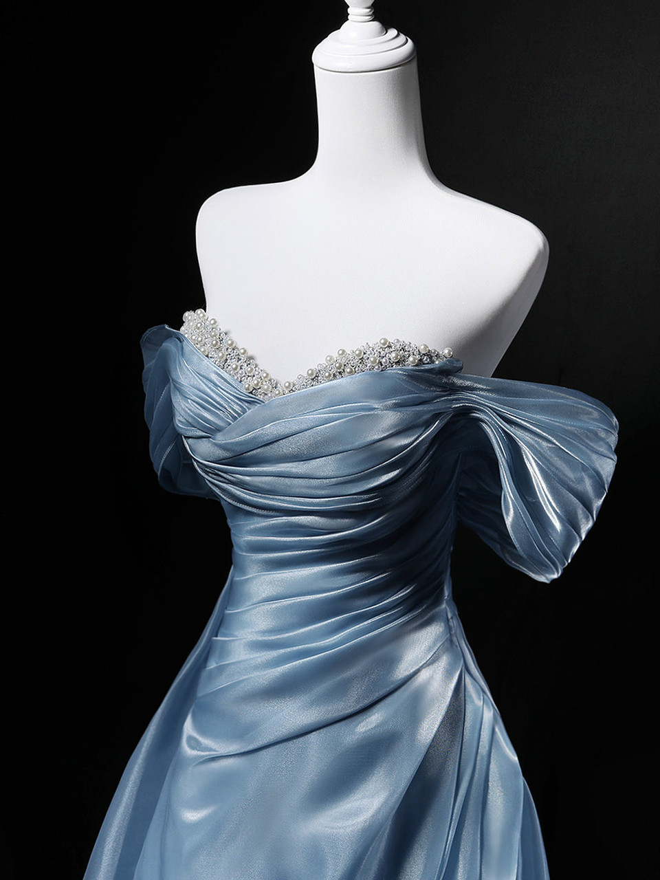 Blue A-line prom dress with off the shoulder draping and lace-up back