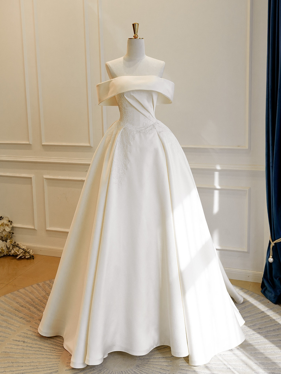 Ivory satin lace wedding dress with off shoulder neckline and pleated bodice
