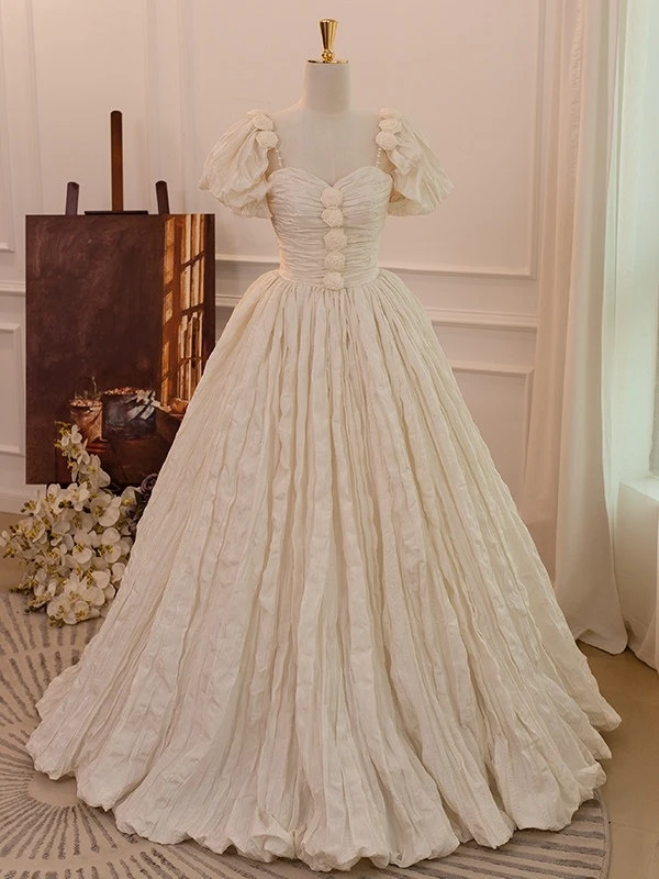 Ivory pleated A line wedding dress with puff sleeves and full skirt