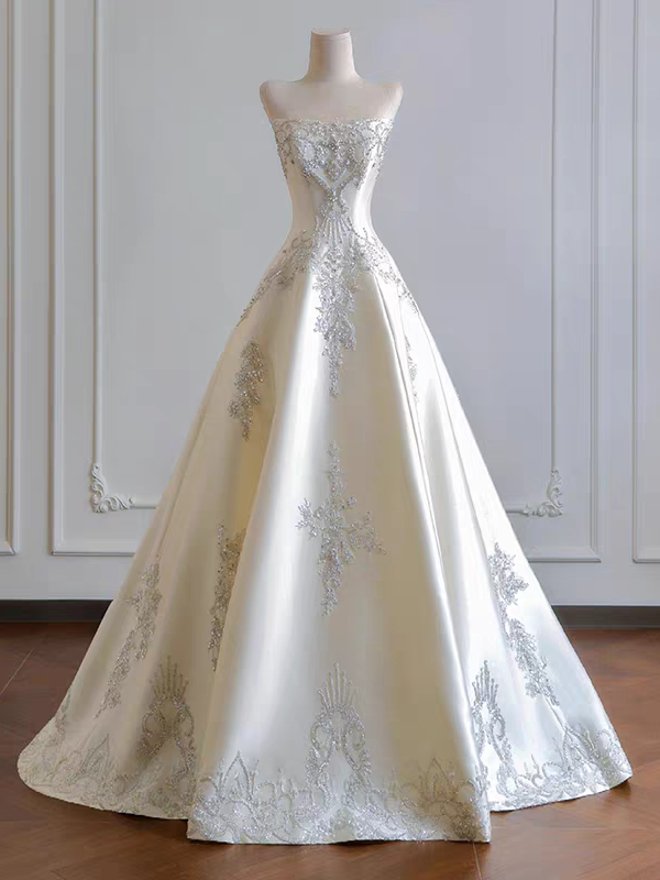Ivory satin strapless wedding dress with full A line skirt and crystal beading