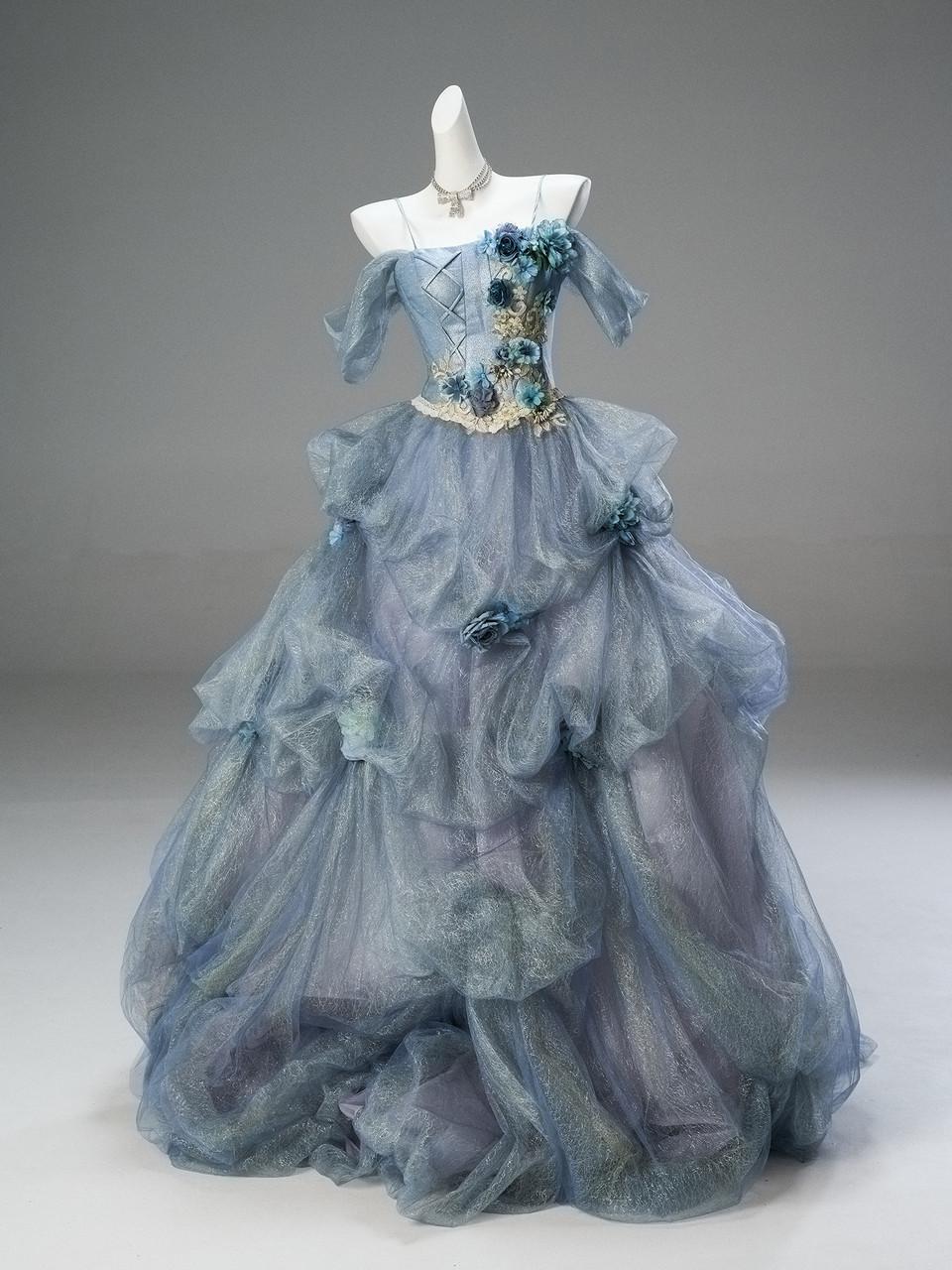 Dusty blue quinceañera dress with gold embroidery and ruffled tulle skirt